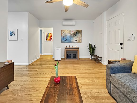living room with entryway to bedrooms