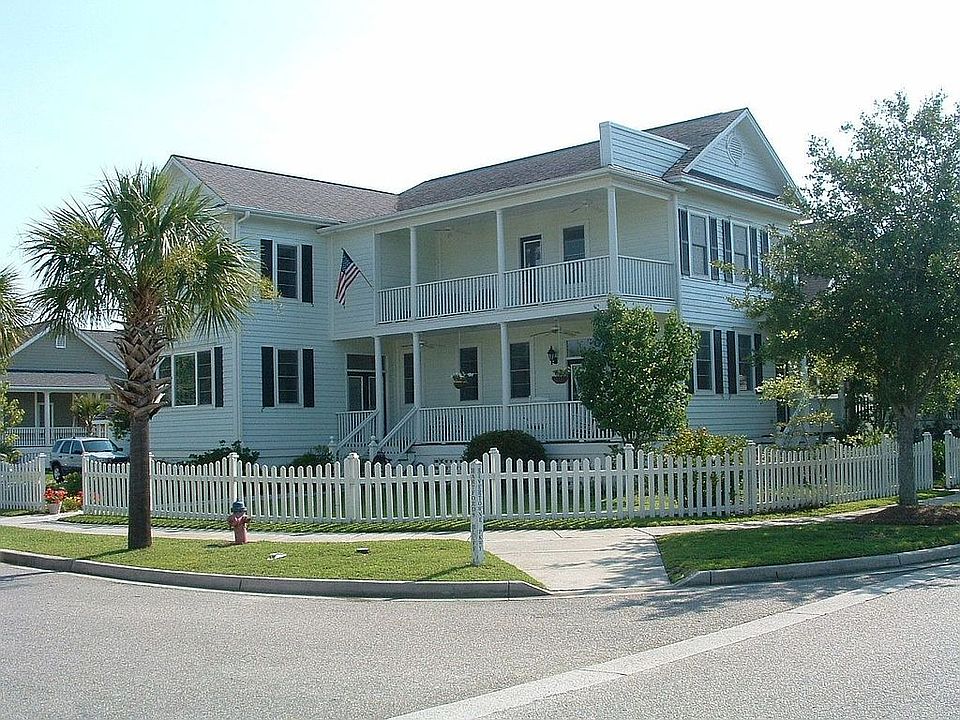 Corner lot with white picket fence