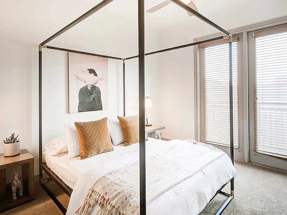 Griffis Uptown apartment bedroom with high ceilings.