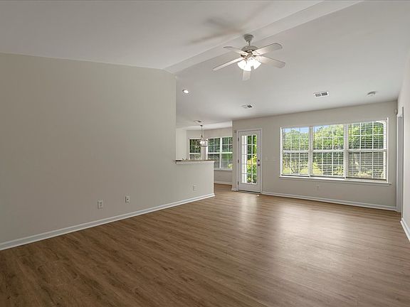 Living room with new flooring and smooth ceiling @ 16 Hawthorne Ct