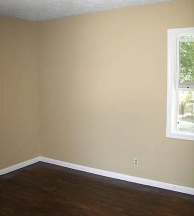 one of three bedrooms
