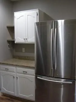 Kitchen storage, wine storage, granite countertops.