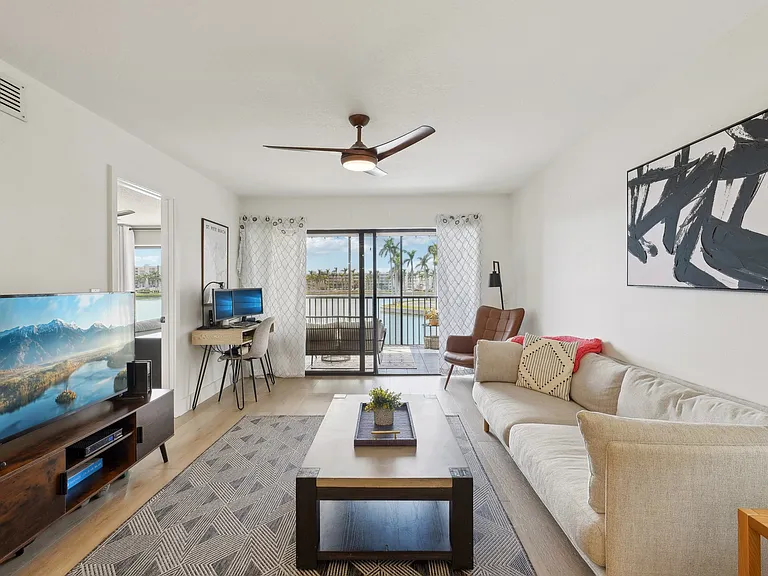 Enjoy the lake view from the waterfront, second-story unit.