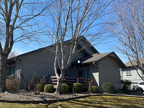 View of townhouse deck from the golf course. Townhouse is located on 8th hole of Brittany Golf Course.