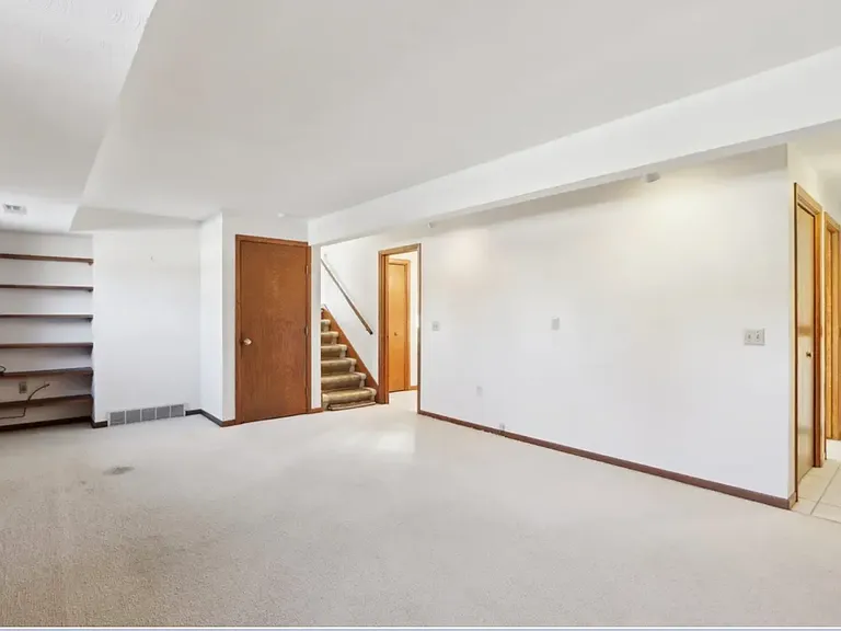 Lower level family room, carpet has been updated.