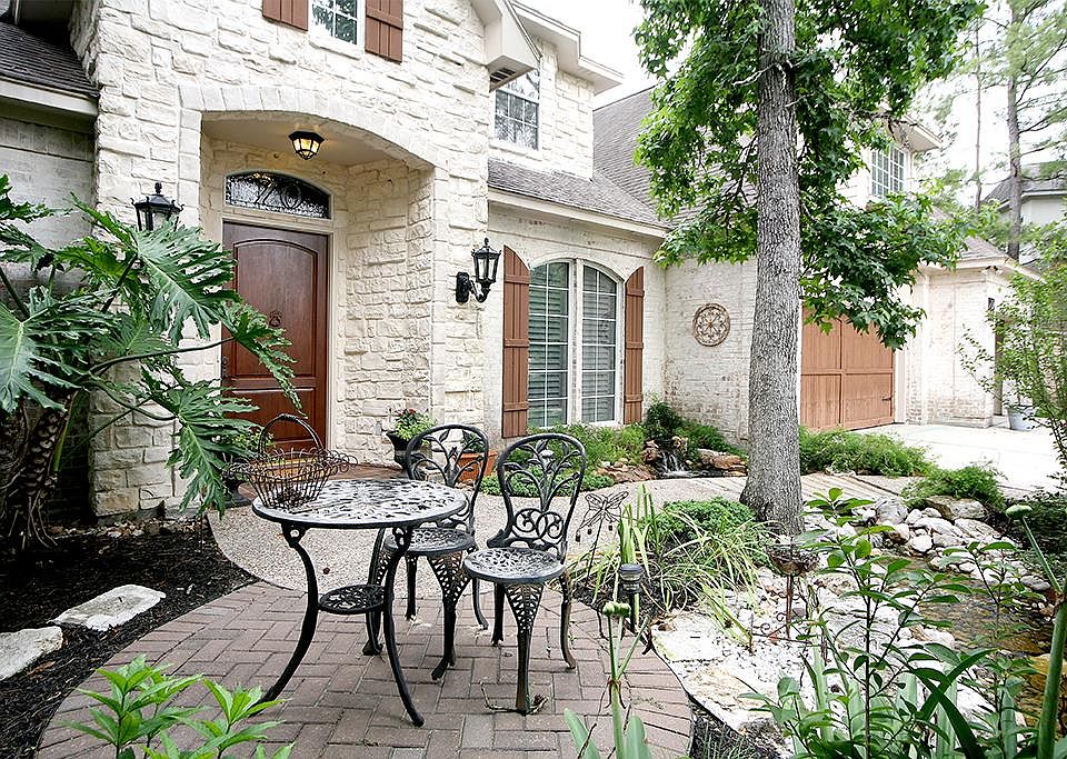 Gorgeous Home on Culdesac! Beautifully landscaped with stream in front yard and lovely sitting area.