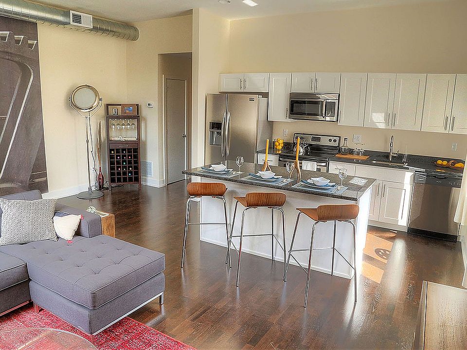 Experience seamless living in this chic open-concept apartment with a modern flair.