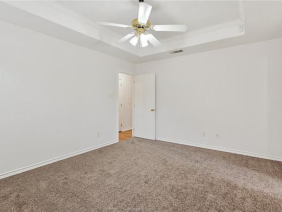 Master bedroom with vaulted ceilings, lots of natural light