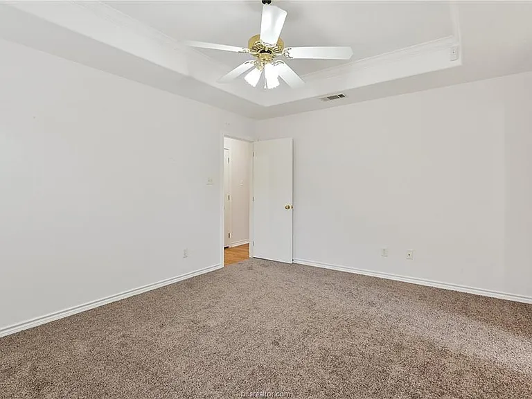 Master bedroom with vaulted ceilings, lots of natural light