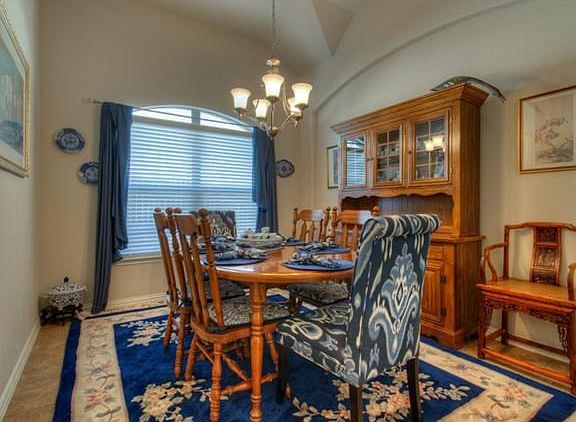 Formal dining room, tile floors, nice big window