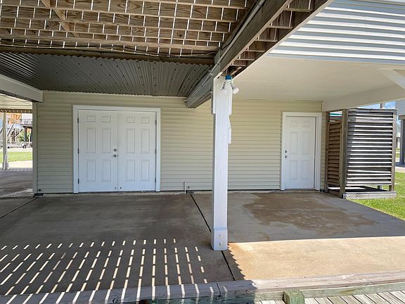 Canal-facing covered area and outdoor shower.