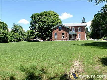 West side of home with 1 acre lawn