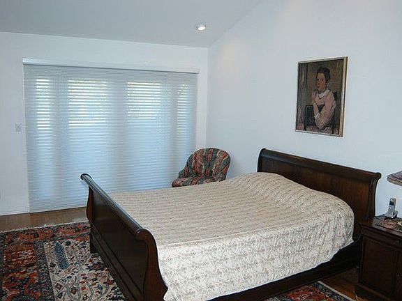 Master bedroom with doors to private patio