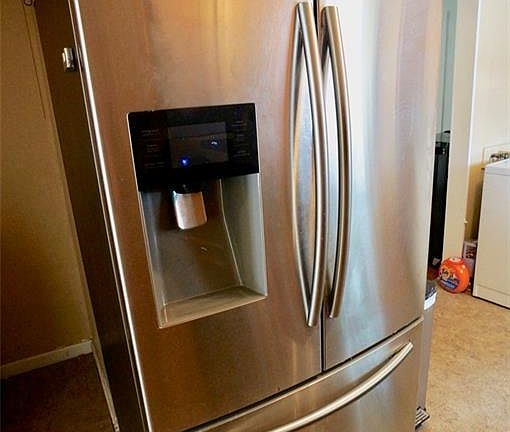 French door refrigerator with ice maker and freezer drawer