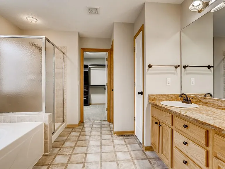 Primary bedroom bathroom looking towards 10 x 8 walk-in closet.