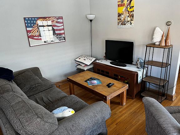 This area is just to the left of the unit entrance. Utilize this cozy layout with room for a desk in the opposite corner of this room or spread out and have it be one open area