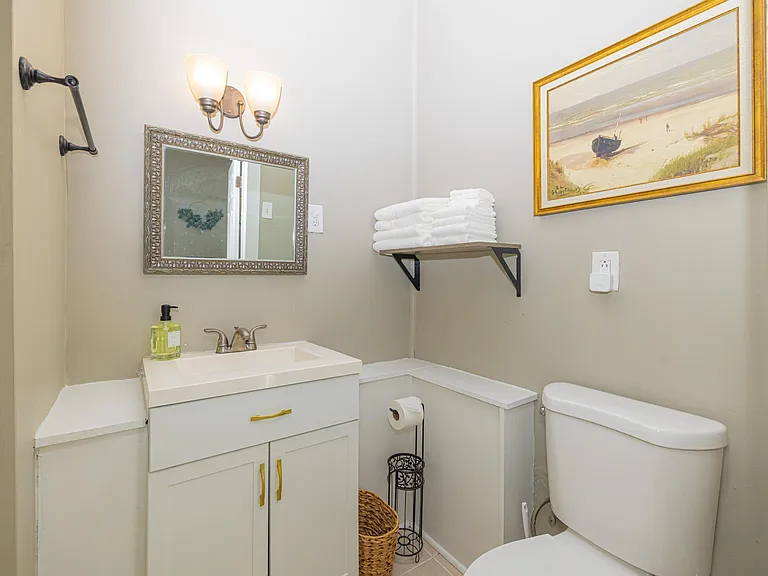 Full bathroom has raised stand-up shower