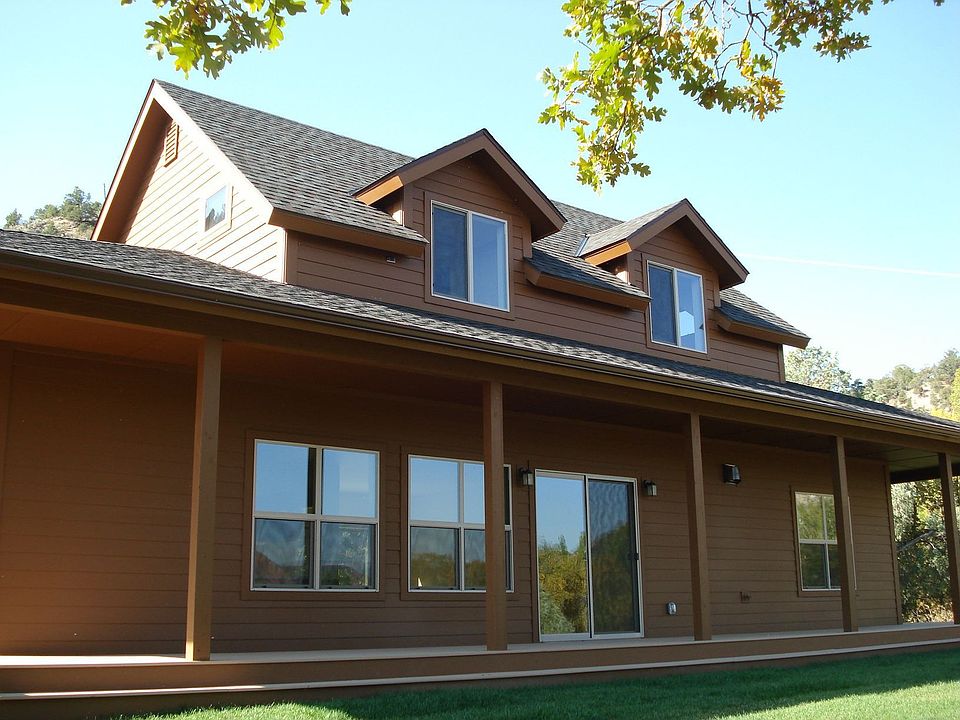 Front View with surrounding porch