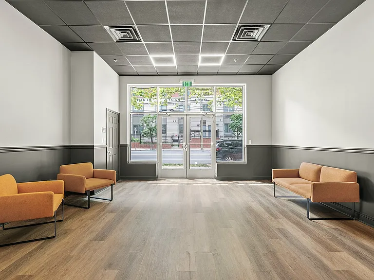 Step into this inviting lobby space that blends modern design with natural light.