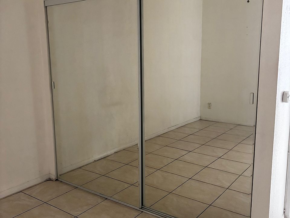 large closet with mirrors