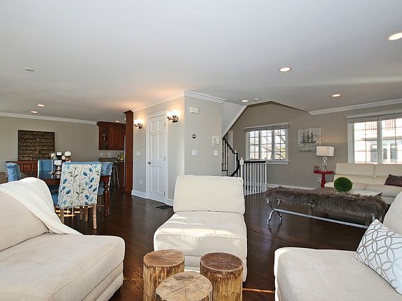 Sitting area looking into living and dining rooms
