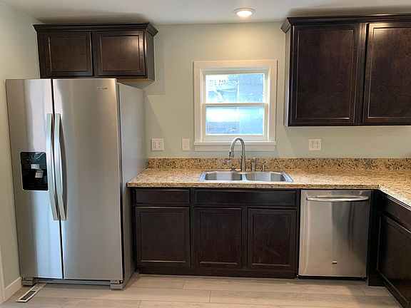 Kitchen: Natural light, dishwasher, refrigerator and more cabinets