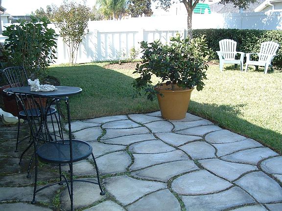Stone Patio Outside Screened Lanai