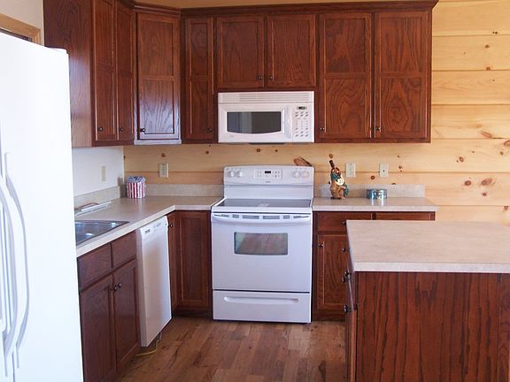 The kitchen is efficient with brand new appliances.