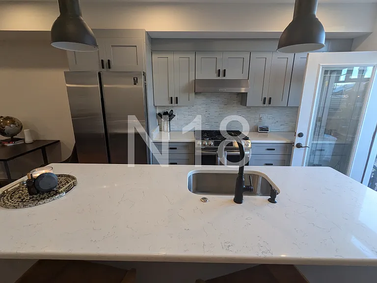 Chef's Kitchen with stainless steel smart appliances & large kitchen island