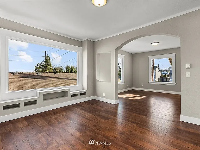 Sunlight pours into the living room, creating a bright, open space that's both welcoming and comfortable.