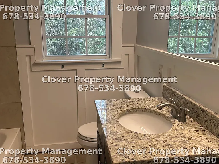 Master Bathroom with Granite countertops.