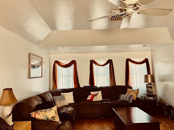 Living Room, with ceiling fan, 3 windows, 24' x 14' (furniture not included)