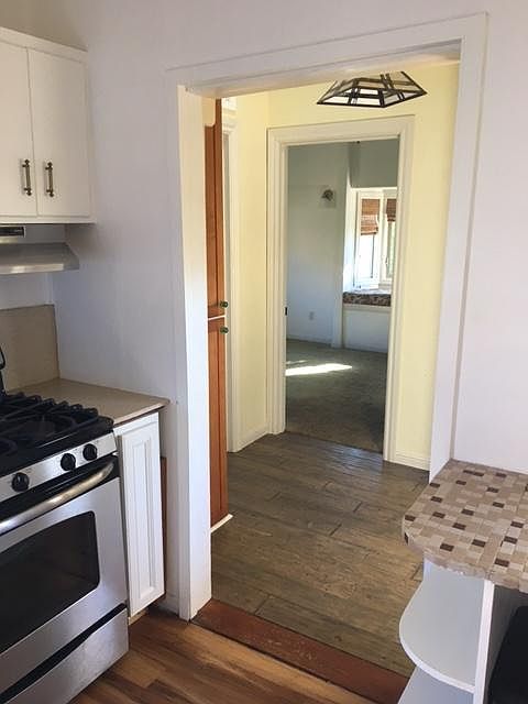 hallway from kitchen into master suite