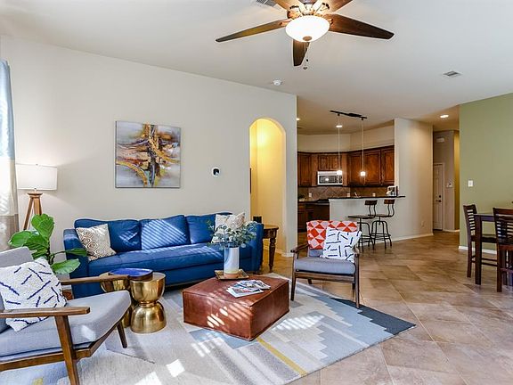 A gorgeous open concept floor plan! This is the living room looking into the dining and kitchen. Notice the very high ceilings a