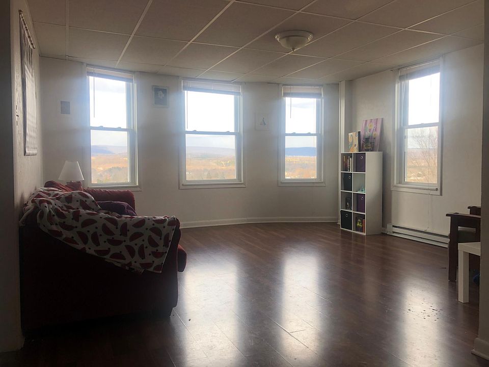 Natural light fills this cozy living room and provides breathtaking views.