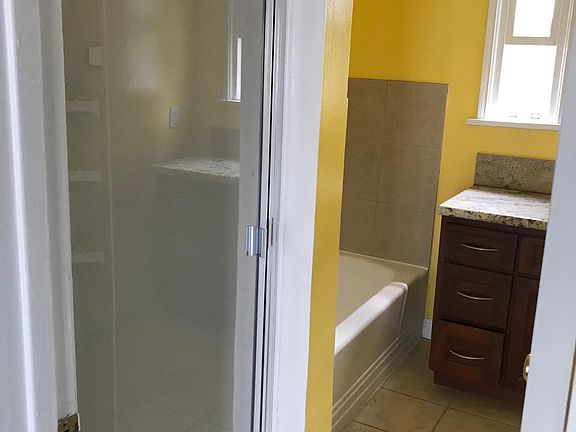 Beautiful bathroom with standing shower and bathtub