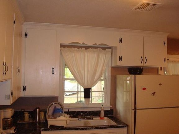Kitchen overlooking backyard