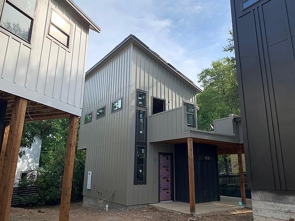 Taken from between main unit (left) and small accessory unit (right) showing the front of the house.