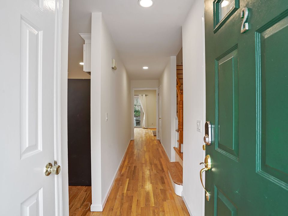 Front hallway opens to kitchen on left and great room beyond