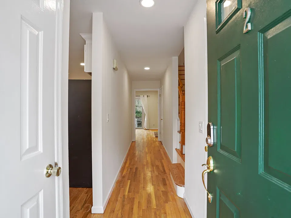 Front hallway opens to kitchen on left and great room beyond