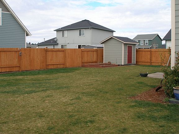large backyard with 8x8 shed