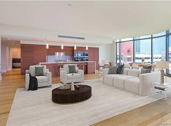 Expansive Great Room looking toward the Chef's Kitchen. Virtually staged photo.