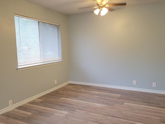 The natural light makes the living room area feel open and fresh.