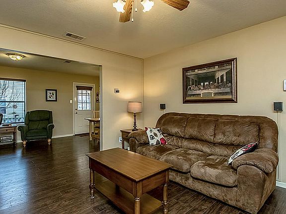The nook in the kitchen could be used as a study or reading space.