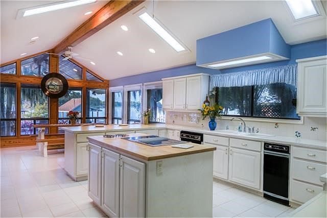 Large kitchen and dining area with plenty of windows.  All appliances stay