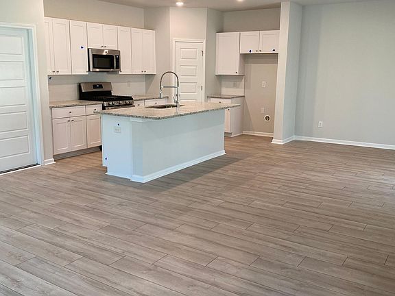 Open kitchen to dinning and family room area. Refrigerator and dishwasher will be installed February 23rd