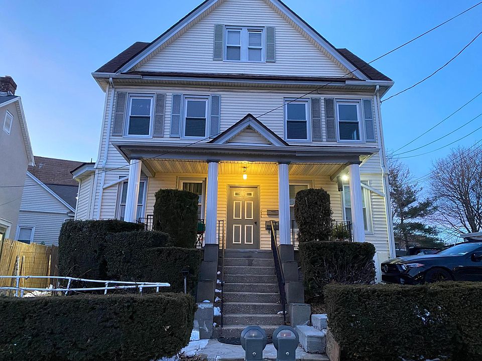 Front view of the house and parking for Tenant is right next to car in photo