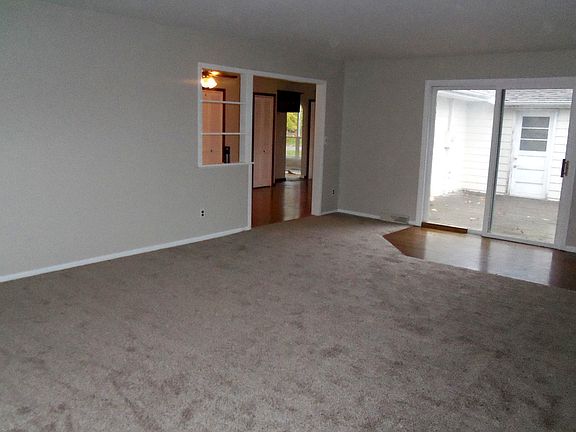 Family room with patio door and back deck.