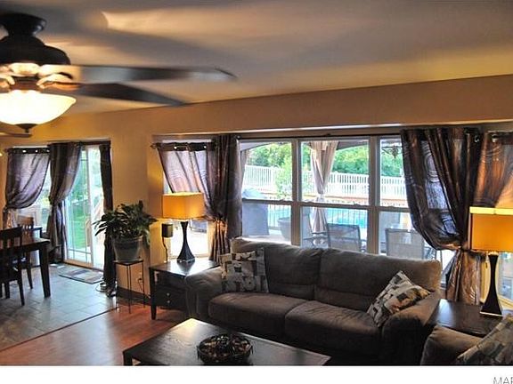 Living room with 5 window bay overlooking the backyard