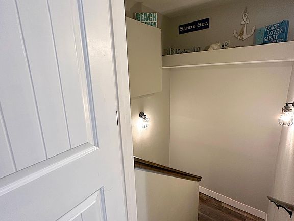 Entrance to downstairs unit with a locked door.